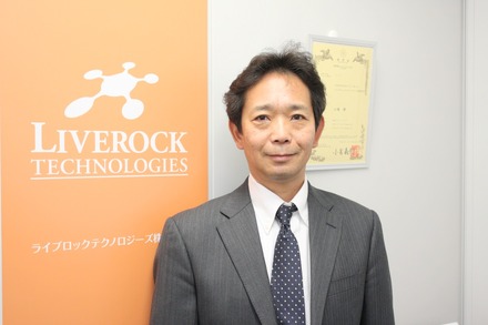 ライブロックテクノロジーズの小嶋修社長。前職の通信機器メーカー時代からIoT／M2M関連のプロジェクトに深く関わり、独立後は、「Coral Edge」を皮切りに、ネットワークカメラ向けソリューションを手がけるようになった（撮影：防犯システム取材班）